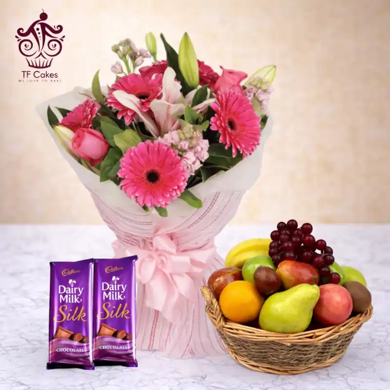 Elegant Pink Flower Bouquet with Fresh Fruit Basket & Dairy Milk Chocolates - TF Cakes Online Delivery Freshly baked handcrafted Elegant Pink Flower Bouquet with Fresh Fruit Basket & Dairy Milk Chocolates – Cake design by TF Cakes
