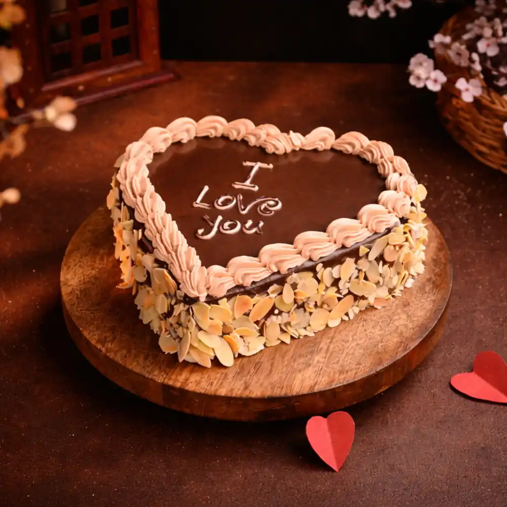 Freshly baked handcrafted I Love You Almond Heart Shape Cake – Cake design by TF Cakes